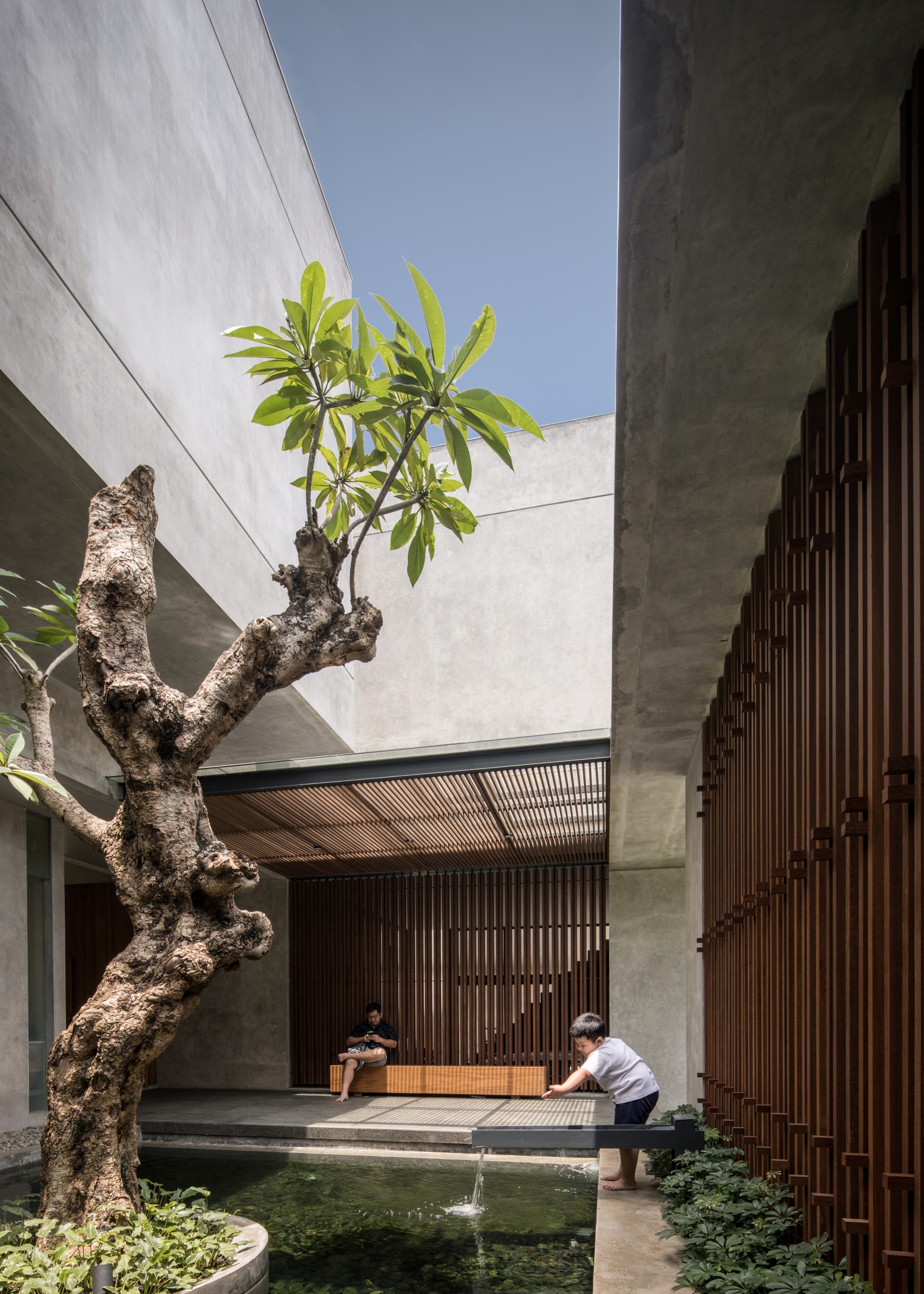 inside the stacking concrete box rj house: project by rakta studio ...