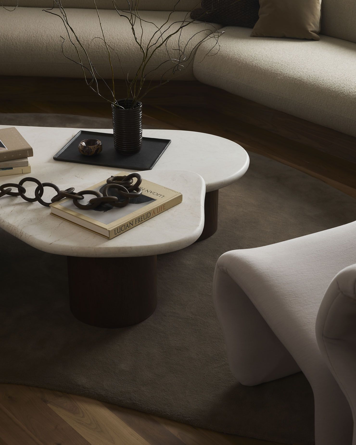 muted tones and sculptural furniture fill corner house with poetic ...