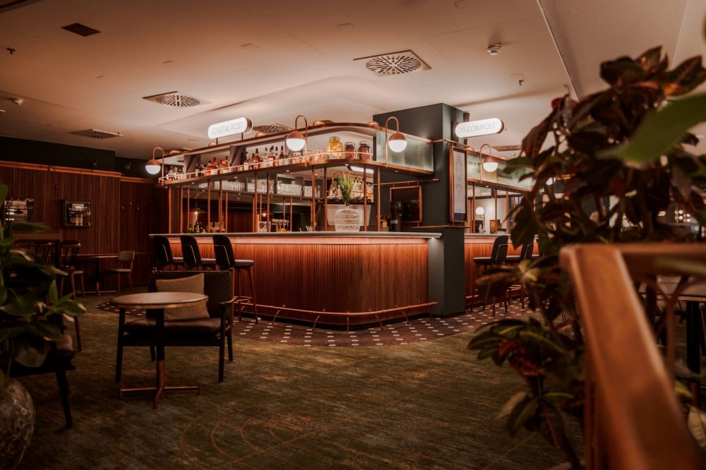 inside a retroinspired pigeon postbar & eatery at hilton cologne