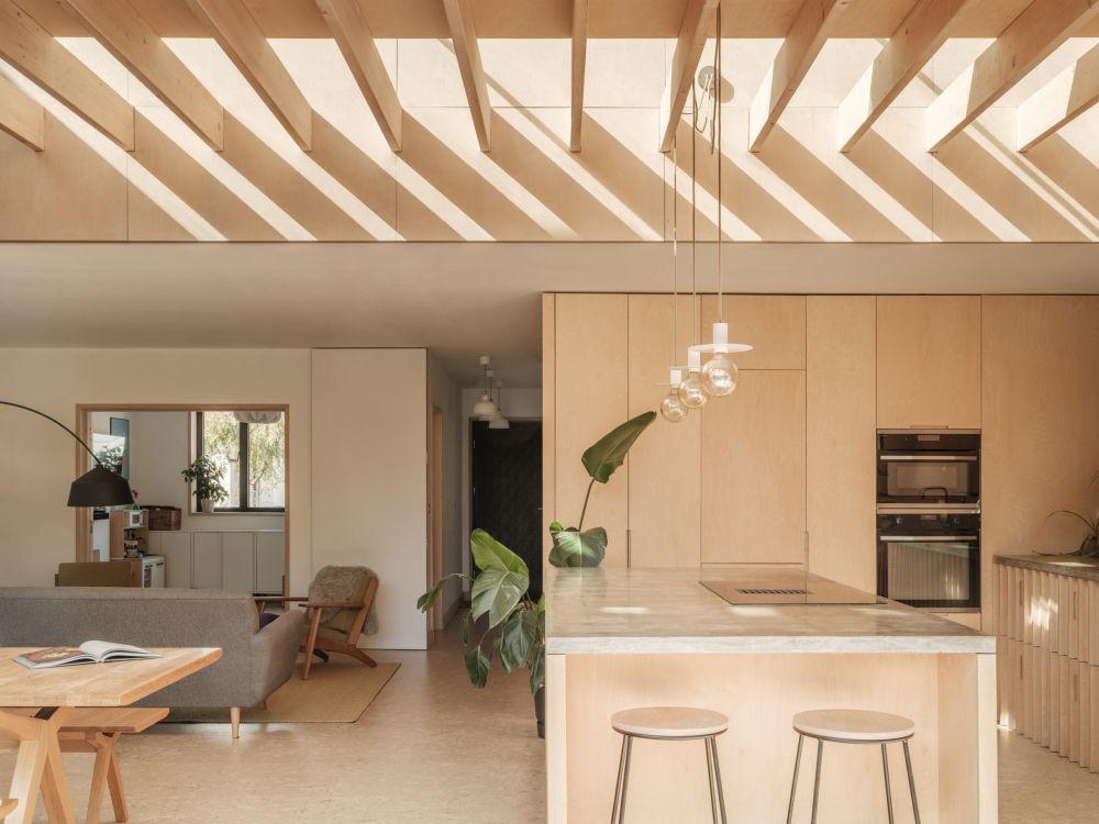 henriksen house extension utilizes birch plywood and clay to form an ...