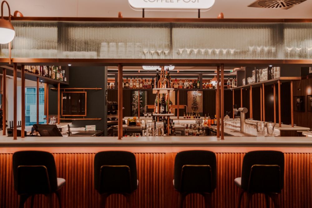 inside a retro-inspired pigeon post-bar & eatery at hilton cologne ...