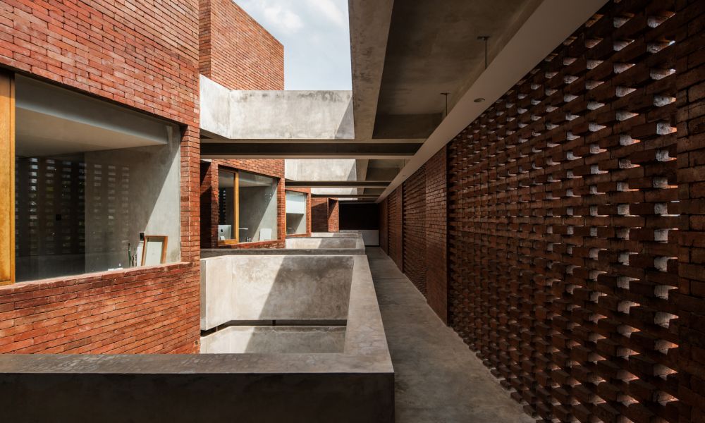 raw and brutalist brick building for kos haji baun in jakarta: project ...