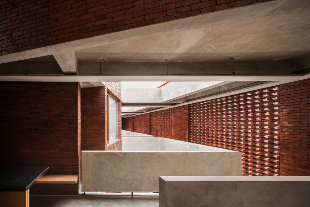 raw and brutalist brick building for kos haji baun in jakarta: project ...