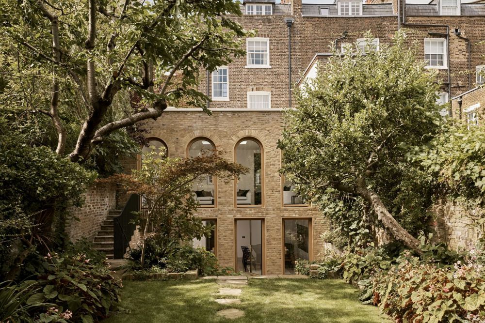 Brick Accents And Graceful Arches Define Timelessness At Laurie House Brick accents and graceful arches define timelessness at laurie house