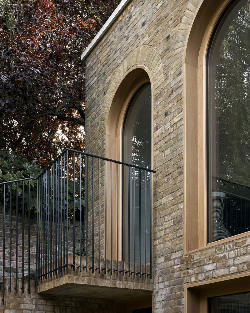 Brick Accents And Graceful Arches Define Timelessness At Laurie House Brick accents and graceful arches define timelessness at laurie house