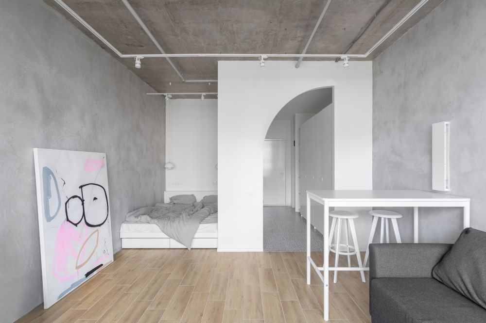 inside the minimalistic and raw half arc compact apartment in moscow ...